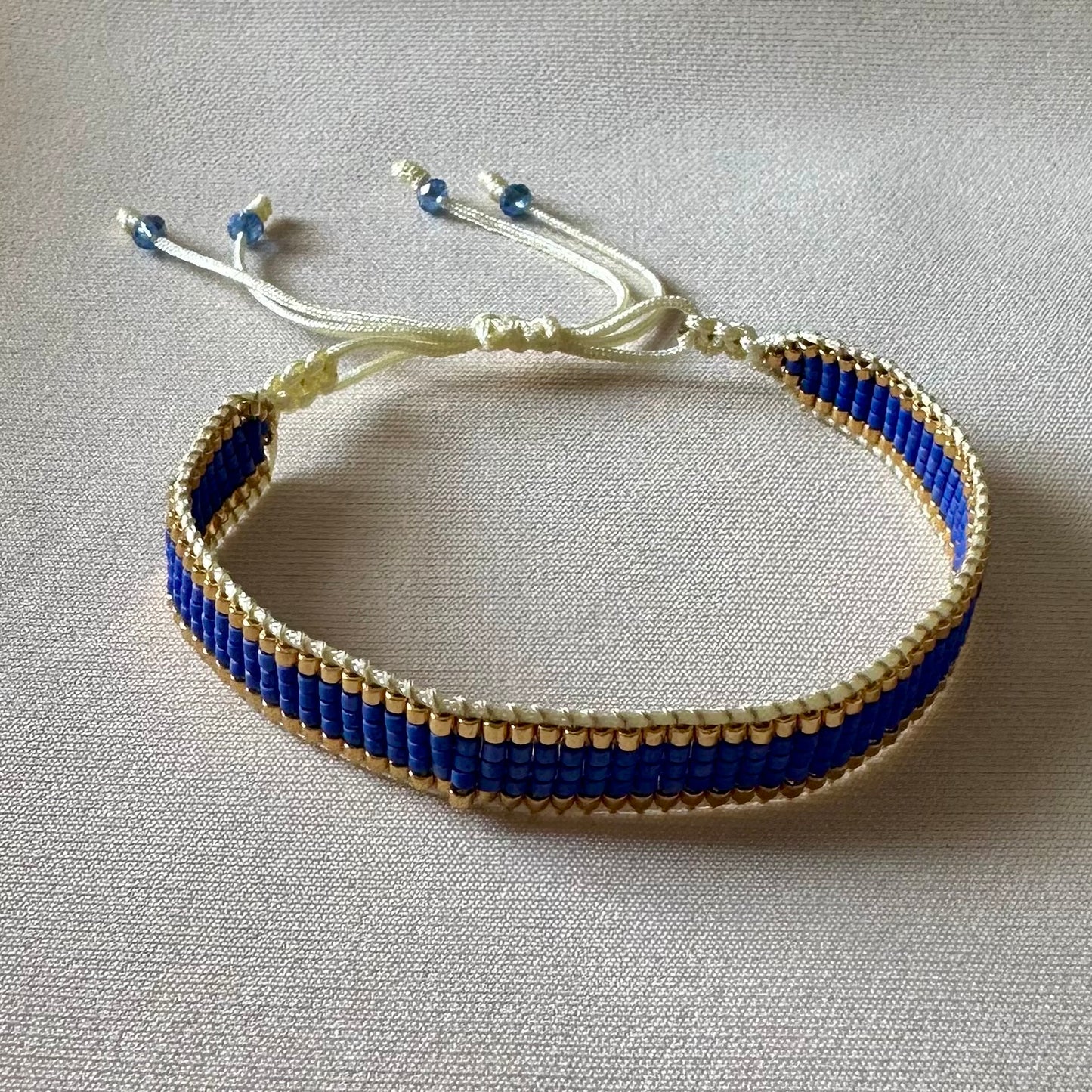 PULSERA AZULINO CON DORADO